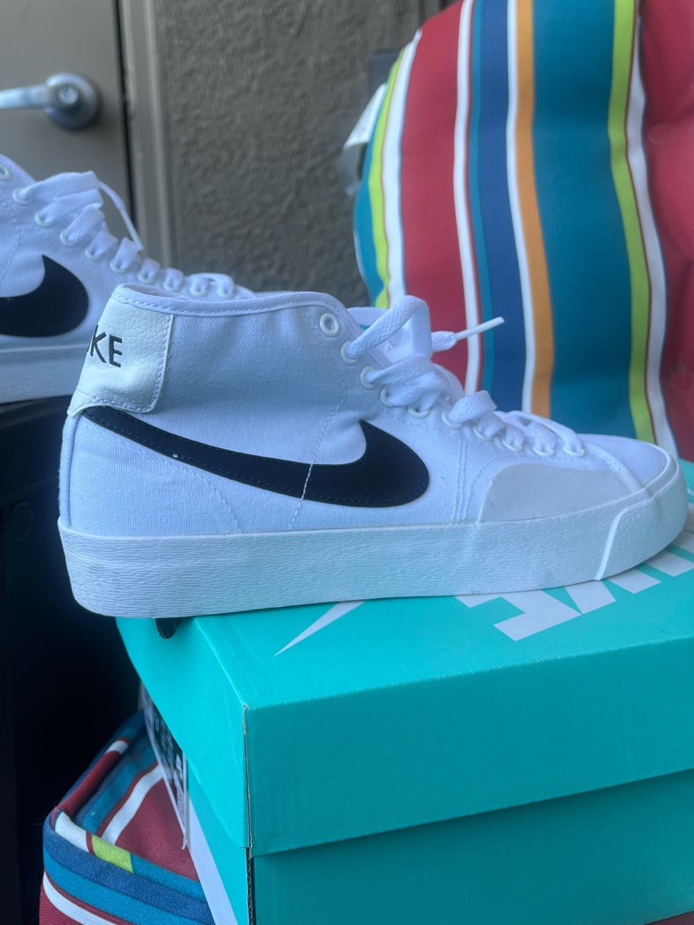 Nike White High-Top Sneakers with Black Swoosh